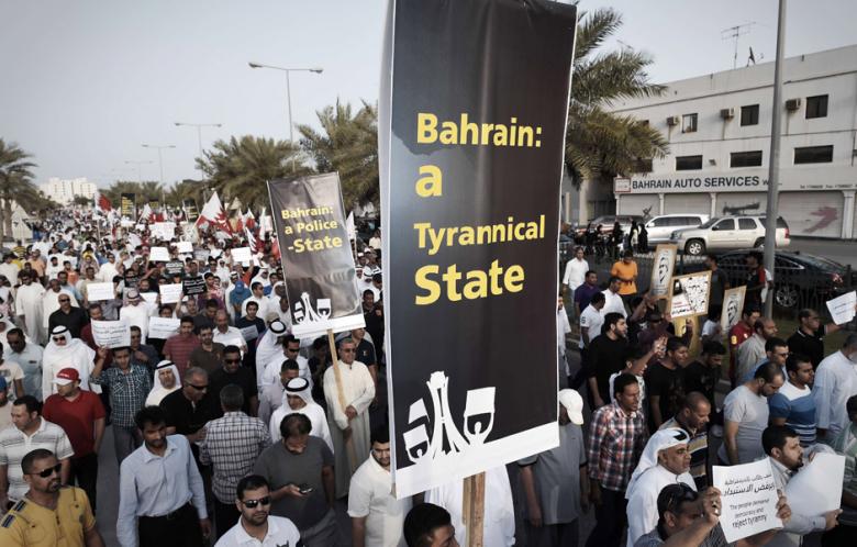 Bahraini demonstrators gather during an anti-government demonstration and against the Formula One Grand Prix in the village of Shakhurah, west of Manama, on April 4, 2014. (Photo: Mohammed al-Shaikh / AFP)