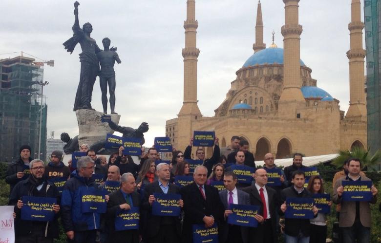 Dozens of demonstrators gather in the Lebanese capital on February 27, 2014 to protest the detention of four Al-Jazeera journalists in Egypt. (Photo: Al-Akhbar - Dania Hawat)