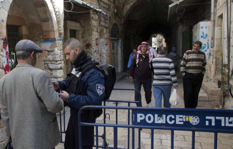 Israeli police check ID's of Palestinians on a checkpoint in an alleyway leading to the al-Aqsa Mosque compound on March 16, 2014, in the Old City of Jerusalem. (Photo: AFP - Ahmad Gharabli)
